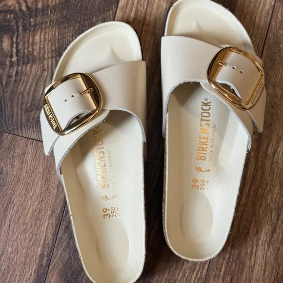 Birkenstock Cream Slide Sandals with Gold Buckles - Picture 1 of 3
